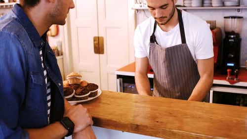 Barista Serving Latte to Customer Paying with Smartwatch