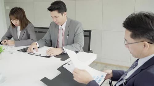 Business Team Meeting Analyzing Reports