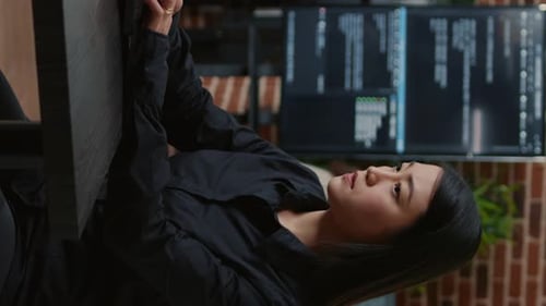 Woman Working at Computer in Modern Office