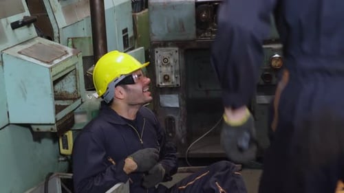 Factory Worker Injured By Accident While Using Machine in Factory