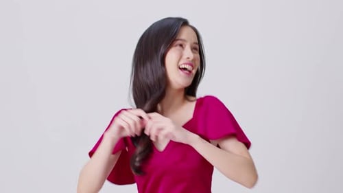 Woman in Pink Dress Dancing and Smiling