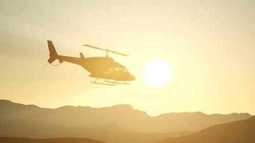 Helicopter Flight Over Mountains at Golden Sunset