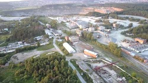 Old Mining Equipment with Grey Gravel Dumps Aerial View