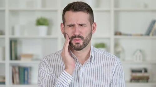 Portrait of Sick Young Man Having Toothache