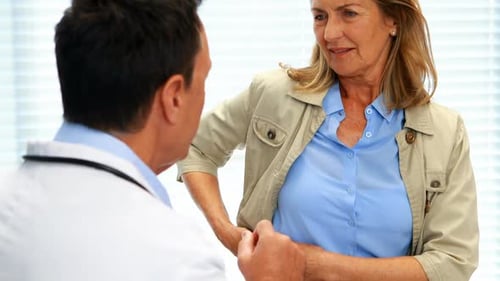 Doctor Examining Patient in Bright Office