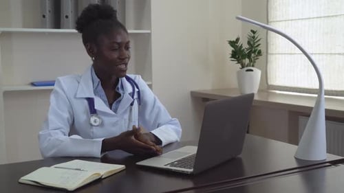 Female Doctor Telehealth Consultation in Modern Office