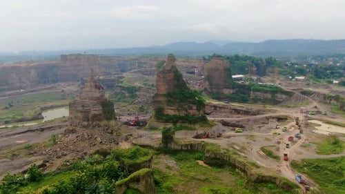 Aerial truck drive though opencast sand mine Brown Canyon in Semarang Indonesia