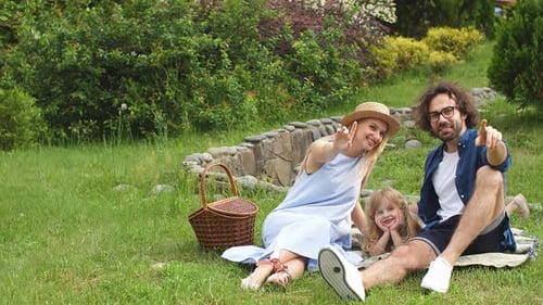 Happy Family Having Fun Outdoors in Green Park