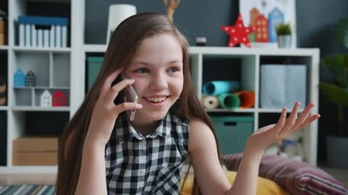 Girl Talking on Phone in Playroom