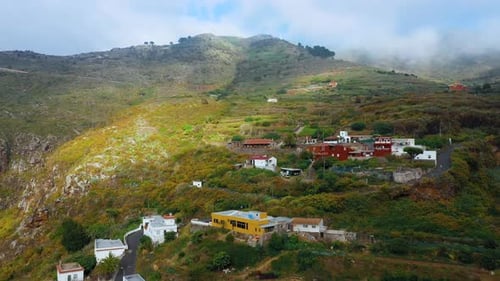 Fligh Over the Mountain Village and the Surrounding Landscape