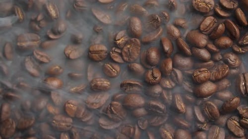 Aromatic Coffee Beans Steaming in a Close Up Shot