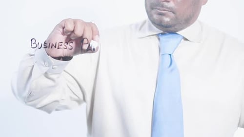 Asian Businessman Writes Business Plan