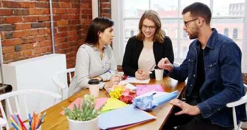 Team Collaborating Around Table in Modern Office