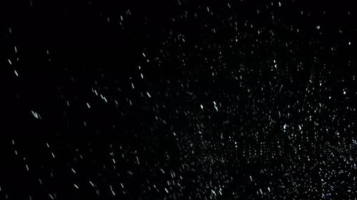 Abstract White Particles Falling on Black Background