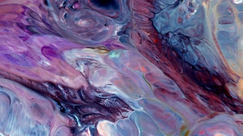 Abstract Footage of Multi-Colored Inks Swirling Together