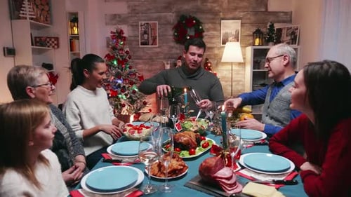 Family Celebrates Christmas with Champagne Toast at Home