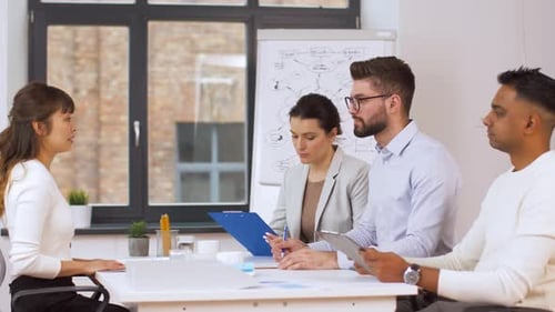 Adults Meet in Bright, Modern Corporate Office