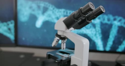 Microscope in Lab with DNA Background