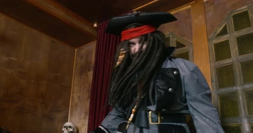 Pirate Costume Aiming a Gun Indoors