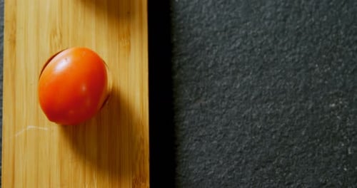 Various tomatoes arrange in wooden tray on grey background 4K 4k