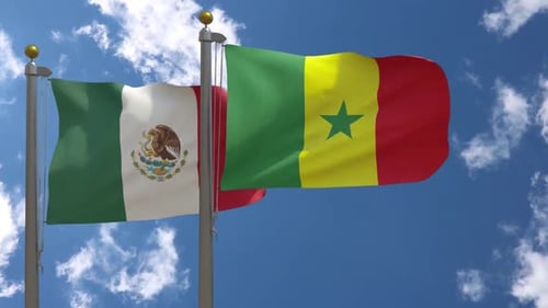 Flags of Mexico and Senegal Waving Together in Blue Sky
