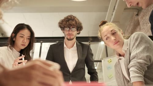 Diverse Team Collaborating on Business Strategy Indoors