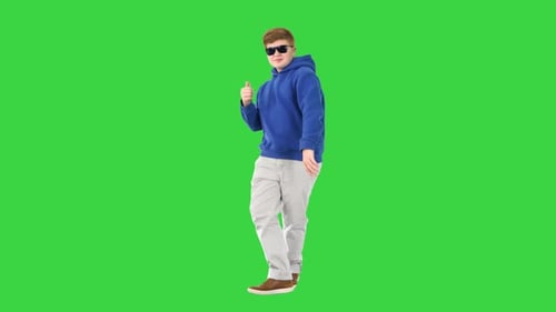 Casual Boy in Sunglasses Walking and Dancing on a Green Screen, Chroma Key