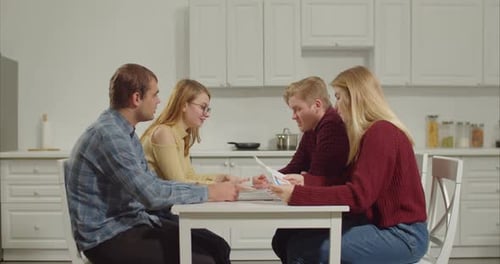 Group of College Students Discussing Ideas for Project