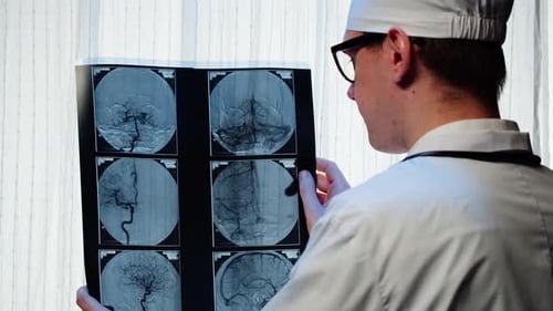 Doctor Examining Xraybrain MRI