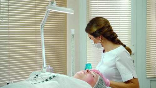 Cosmetologist Applying Permanent Make Up on Eyebrows