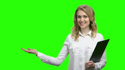 Woman with Clipboard Presenting on Green Screen
