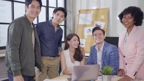 Smiling Team Posing in Modern Office