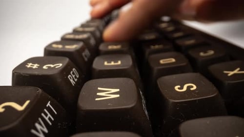Person Typing on Computer Keyboard