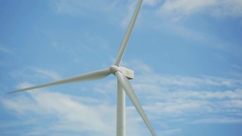 Wind turbines or windmills farm field in industry factory.