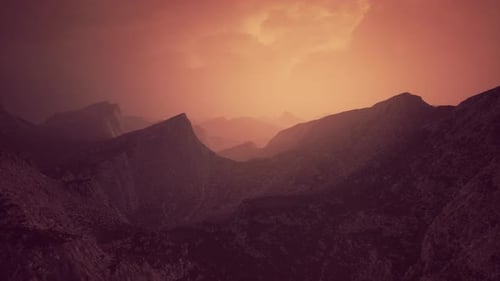 Dramatic Sky Over Rocky Mountains at Sunset