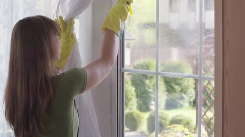 Wiping Window Using Spray Detergent, General Spring Cleaning Concept