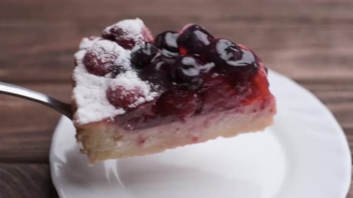 Slice of Berry Pie on White Plate