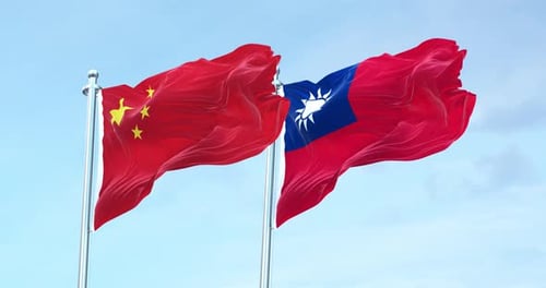 China and Taiwan Flags Waving Together against Blue Sky