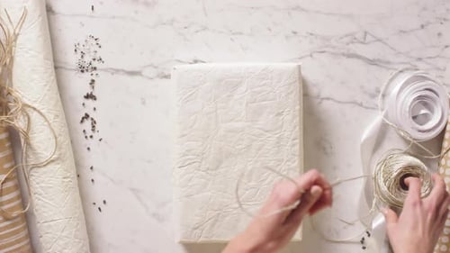 Woman Wrapping Presents At Home