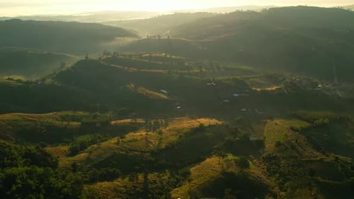 4K Morning mist over a rural village in the high mountains.