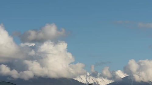 Snowy Mountain Against Cloudy Sky