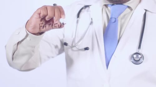 Doctor Writes Fatigue on Clear Surface