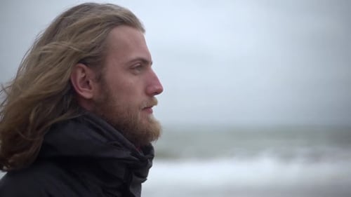 Bearded Man Looking Out Over the Ocean
