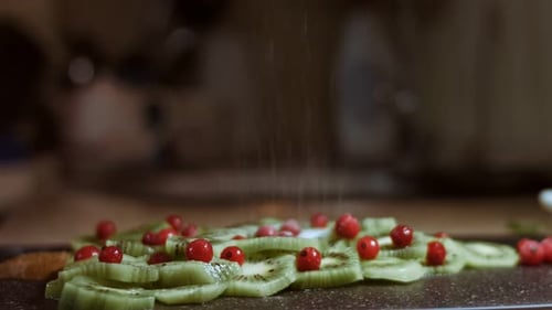 Kiwi and Currants Sprinkled with Powdered Sugar