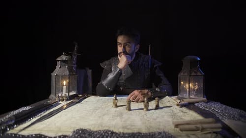 Man Planning Strategy with Map and Figures