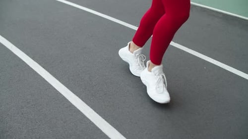 Close Up of Woman Runner Feet Running at Sport Stadium. Female Feet Running