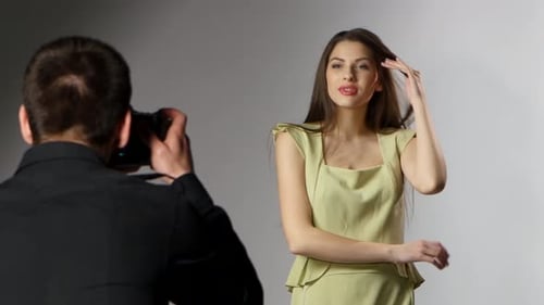 Photoshoot in the Studio. Young Model and Photographer. Close Up