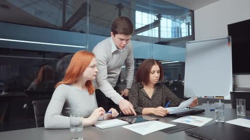 Business Colleagues Working Together in a Bright Office