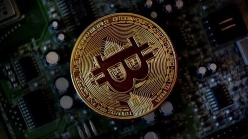 Macro shot of Bitcoin on a Circuit Board