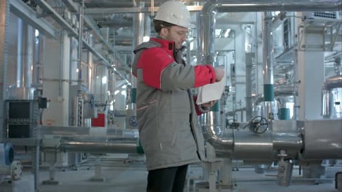 Mechanical Inspector Does Inspection on a Plant